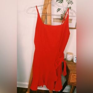 Red, mid-length dress, extra fabric for bows, zip-up, spaghetti strap.